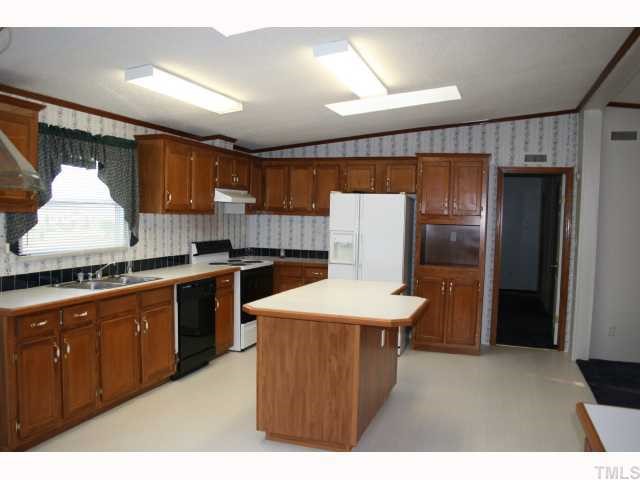 Wow!  Look at the HUGE kitchen.  Appliances convey.  Dining area has built in hutch with room for a good size kitchen table.