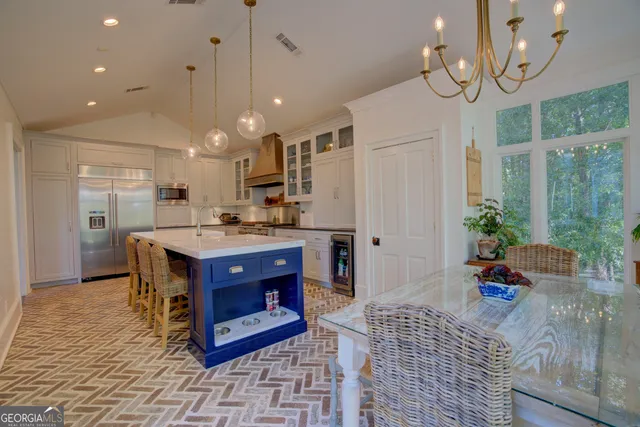 a bathroom with a granite countertop sink mirror and tub