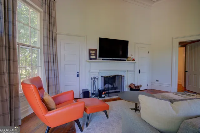a view of a balcony with wooden floor and bench