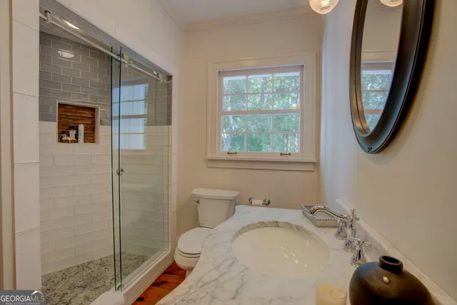 a view of a pathway with a house in the background