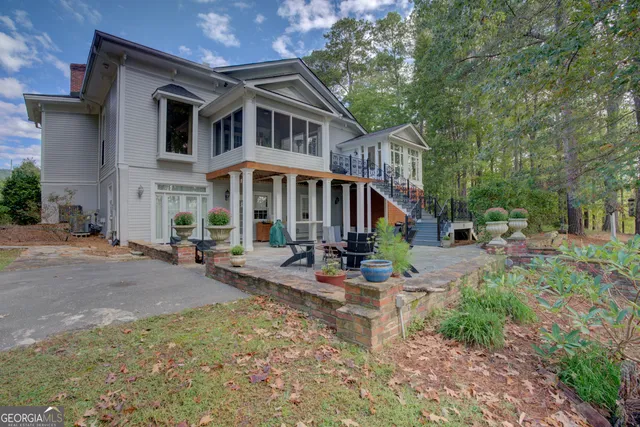 a bedroom with a bed a fireplace and a window with outer view