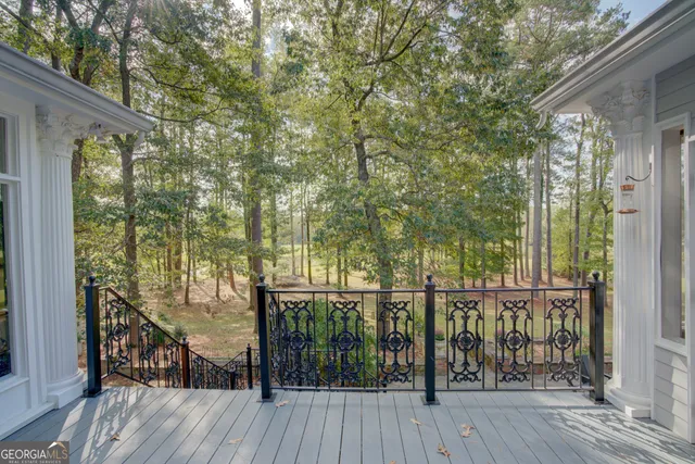 a en suite bathroom with a granite countertop sink and a mirror