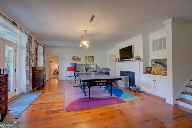 a bedroom with a bed and a fireplace