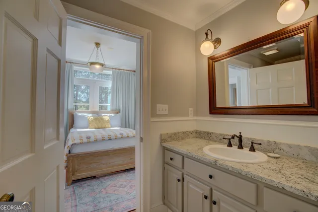 a bathroom with a toilet a sink and a mirror