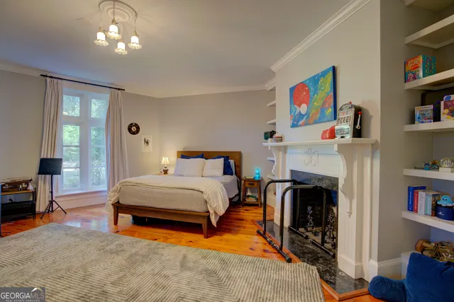 a view of a kitchen with fridge and workspace