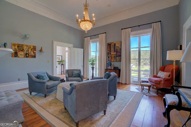 a view of an entryway with wooden floor