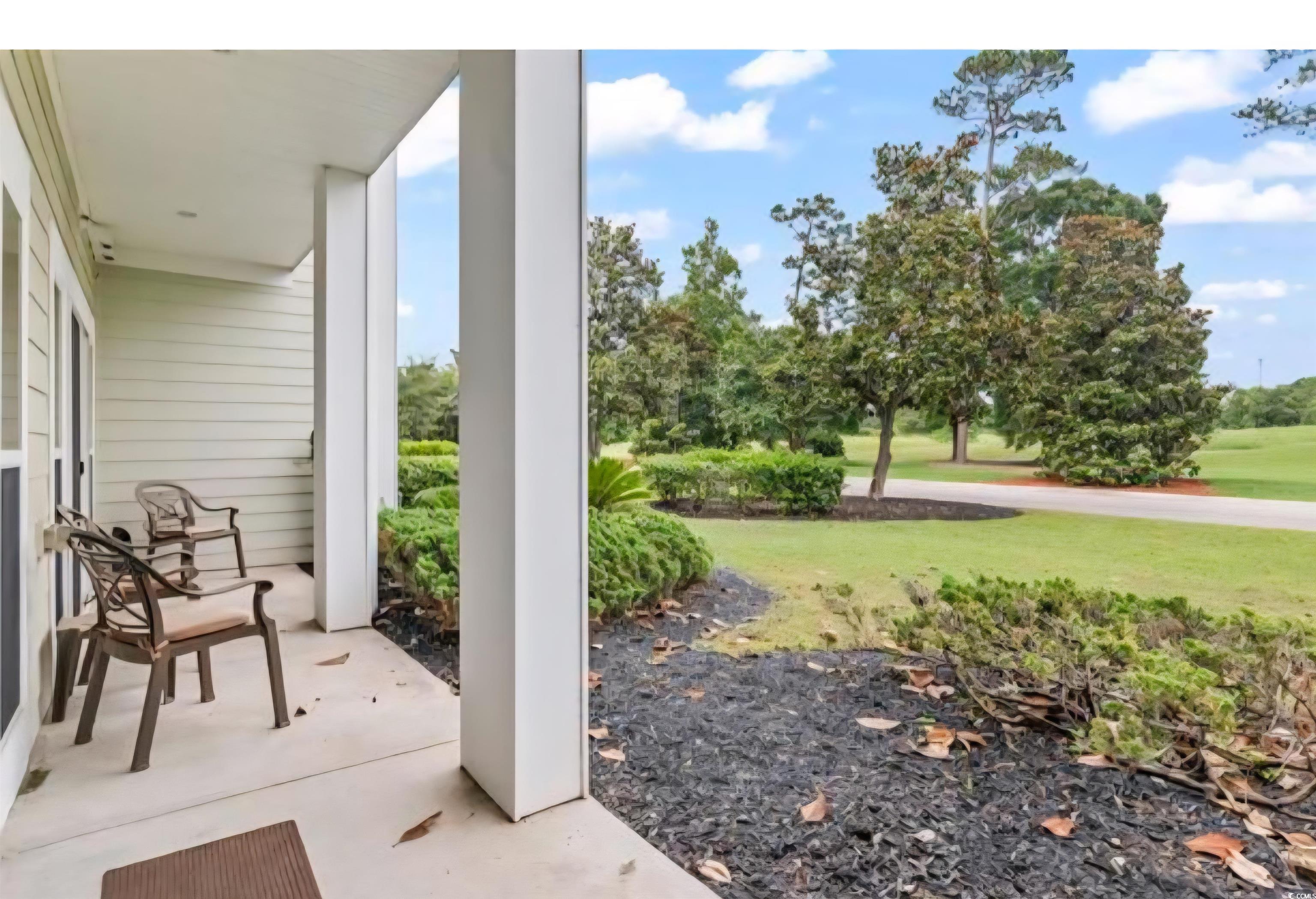 1009 World Tour Boulevard Myrtle Beach, SC 29579 - Photo 12 of 36 Covered porch with a lawn