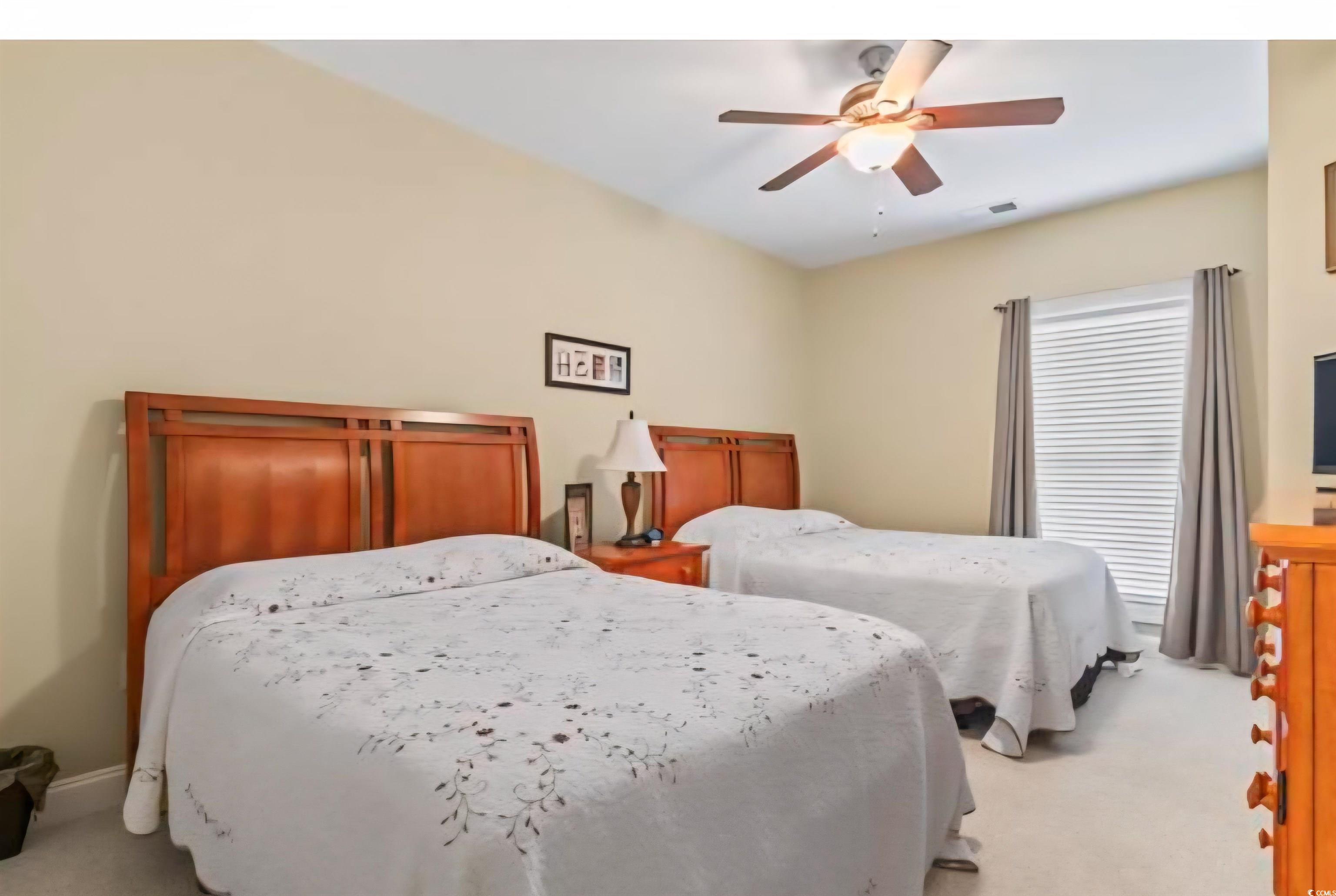 1009 World Tour Boulevard Myrtle Beach, SC 29579 - Photo 13 of 36 Carpeted bedroom featuring a ceiling fan