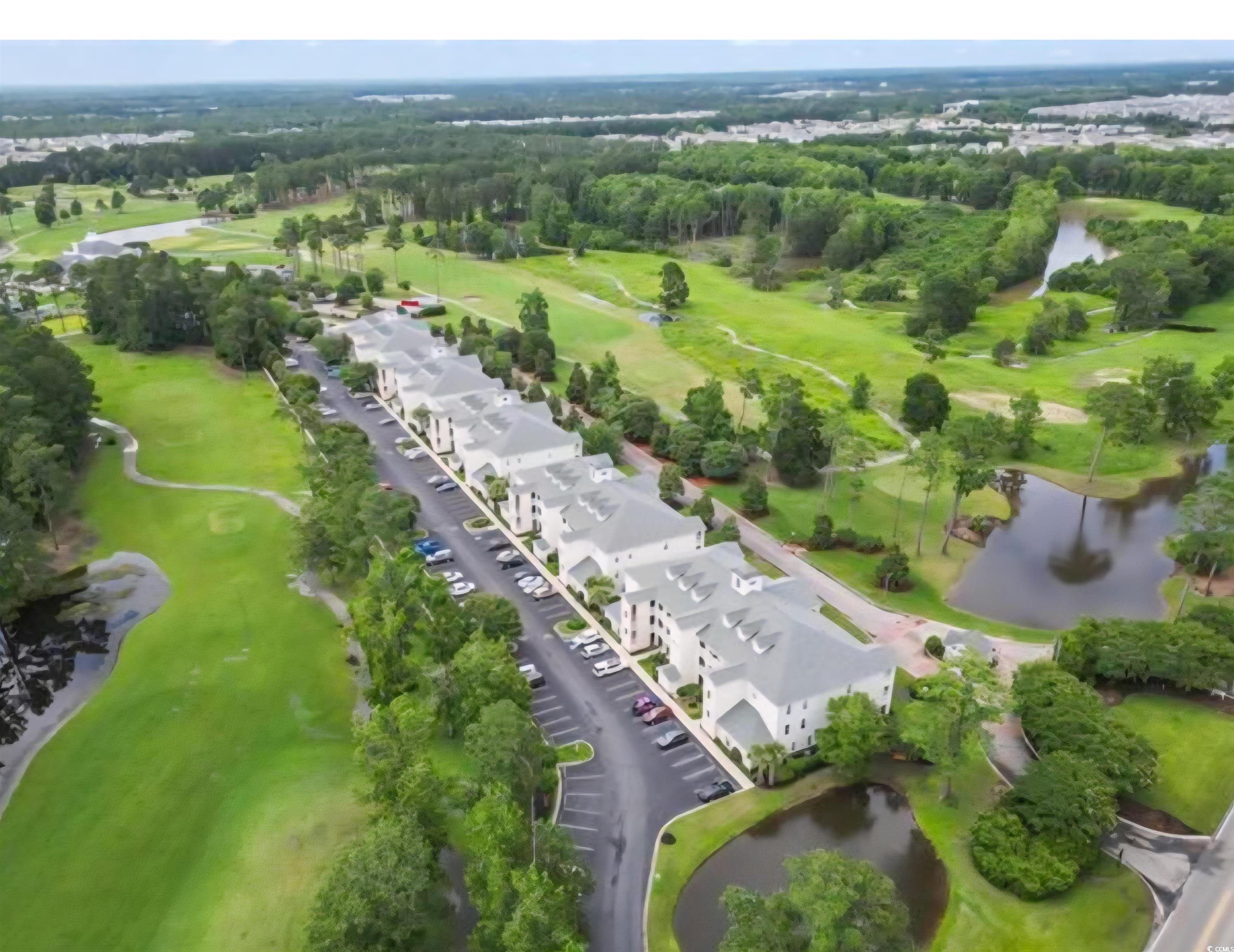 1009 World Tour Boulevard Myrtle Beach, SC 29579 - Photo 17 of 36 Bird's eye view of a nearby body of water and a local golf course