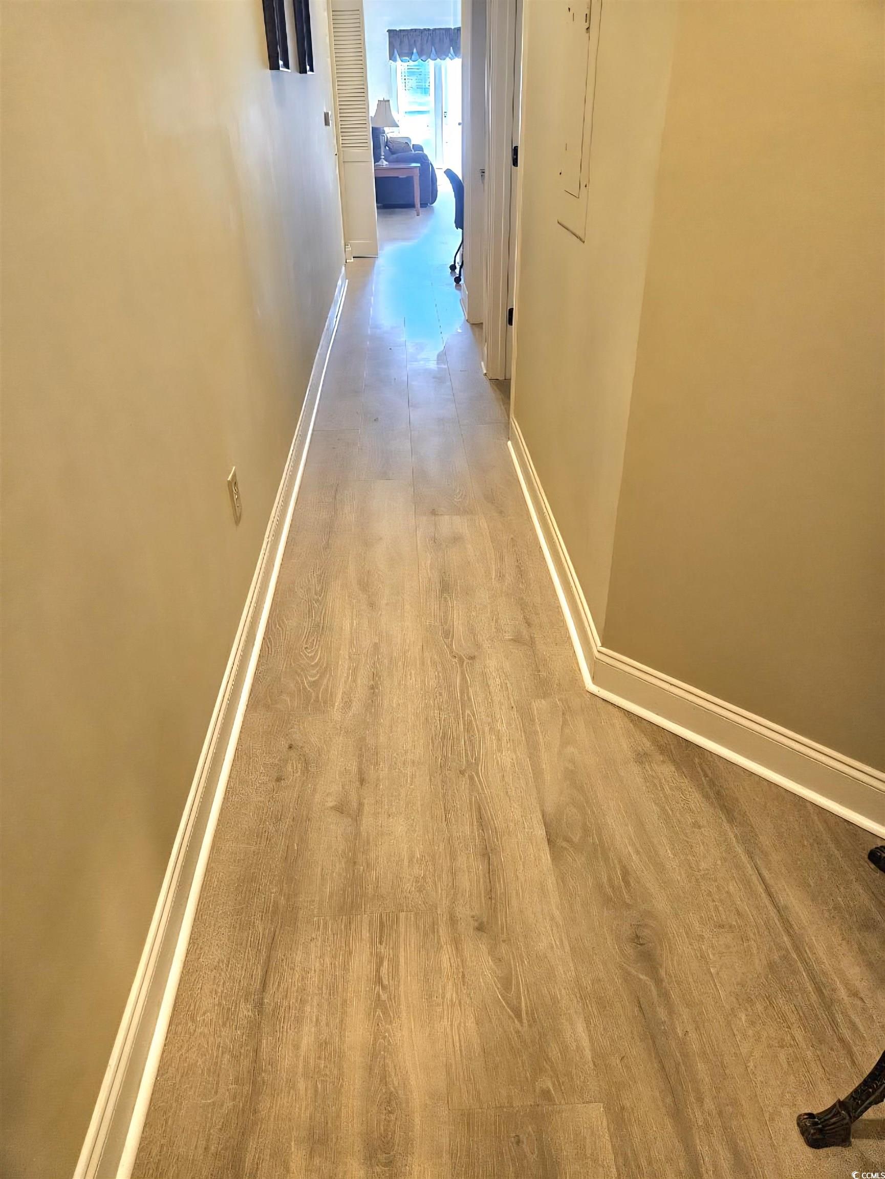 1009 World Tour Boulevard Myrtle Beach, SC 29579 - Photo 3 of 36 new floors . Hallway with light wood-type flooring and baseboards