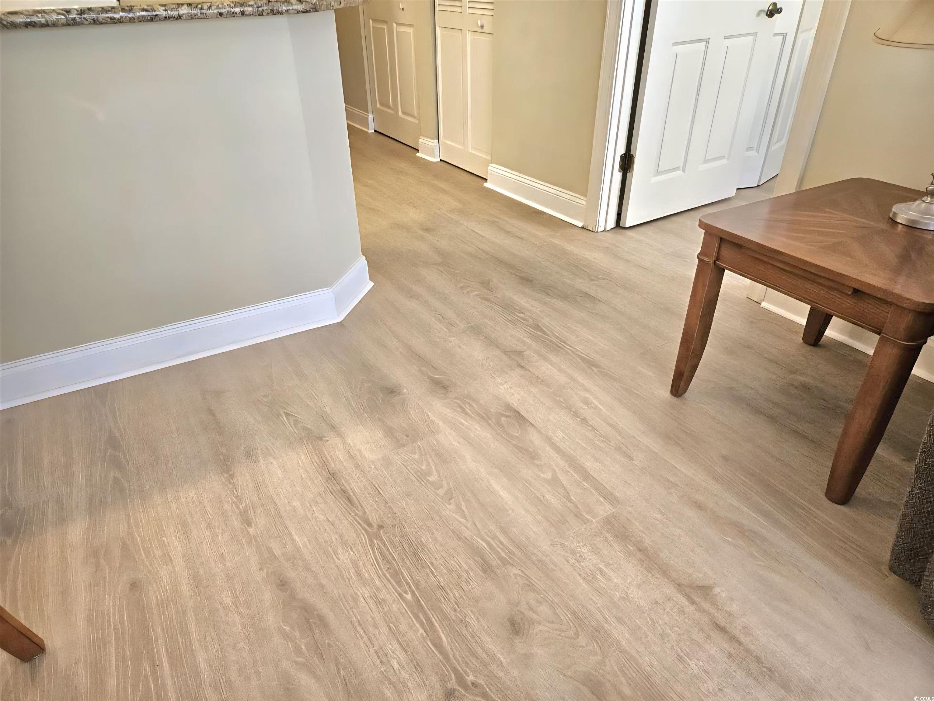 1009 World Tour Boulevard Myrtle Beach, SC 29579 - Photo 8 of 36 new floors , Hall featuring light wood finished floors and baseboards