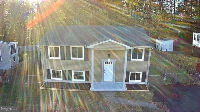 a aerial view of a house with a yard