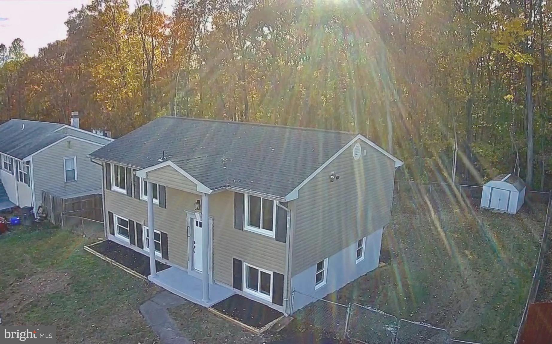 13014 Kerrydale Road Woodbridge, VA 22193 - Photo 3 of 53 a aerial view of a house with a yard