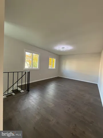 a bedroom with bed and a potted plant