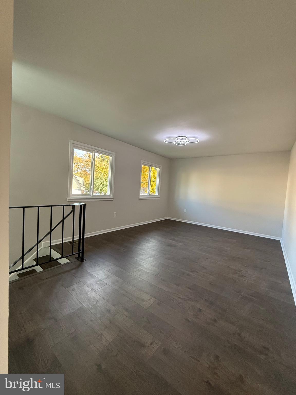 13014 Kerrydale Road Woodbridge, VA 22193 - Photo 39 of 53 an empty room with windows and hardwood floor