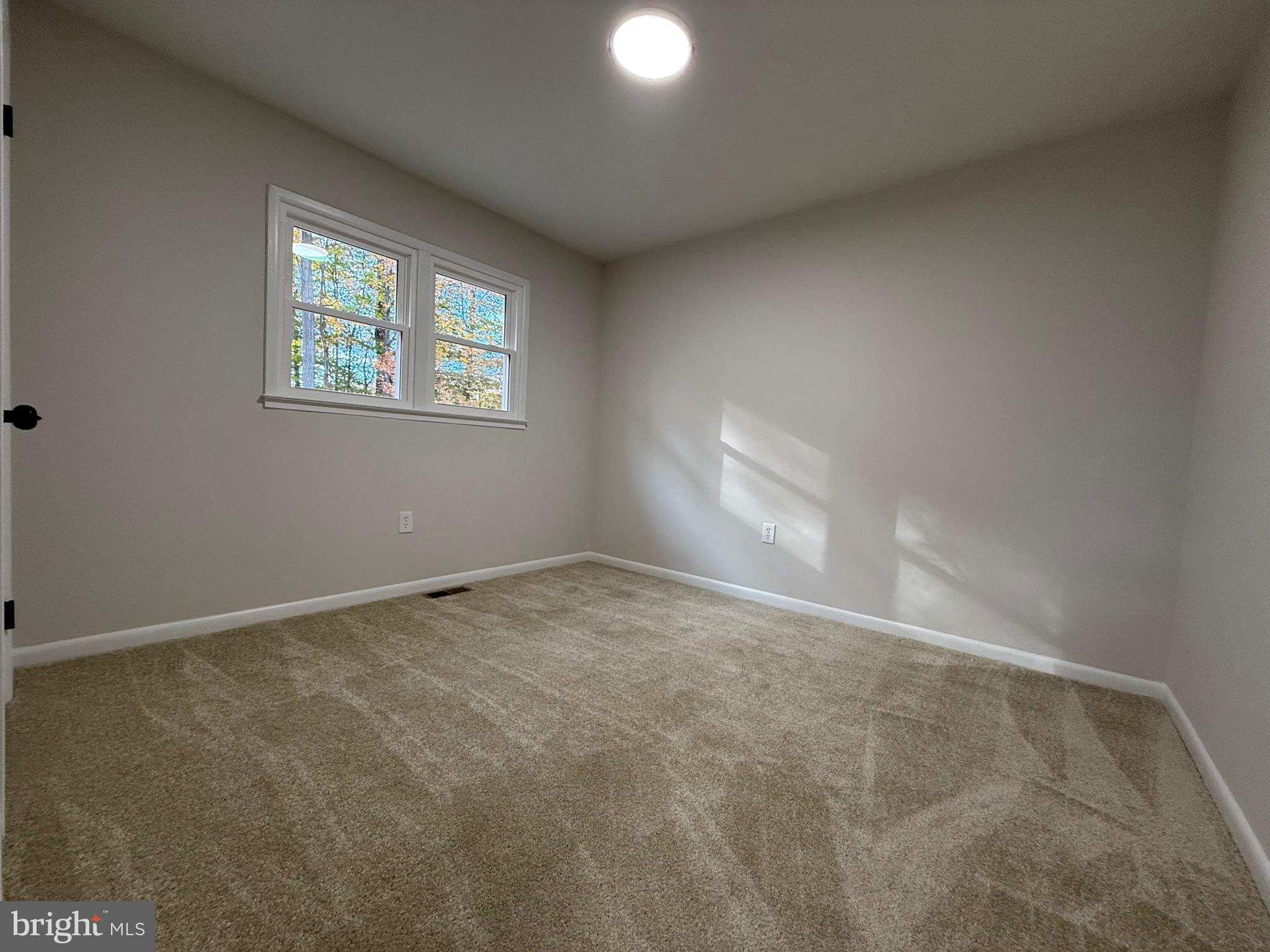 13014 Kerrydale Road Woodbridge, VA 22193 - Photo 43 of 53 an empty room with windows and closet