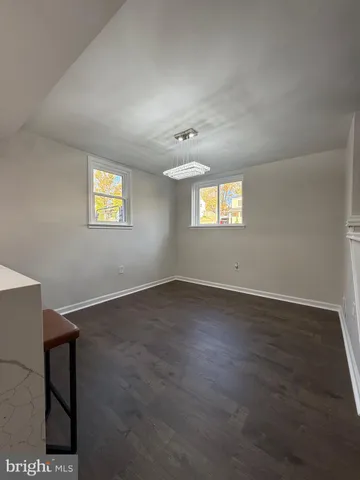 a bedroom with a bed and a night stand