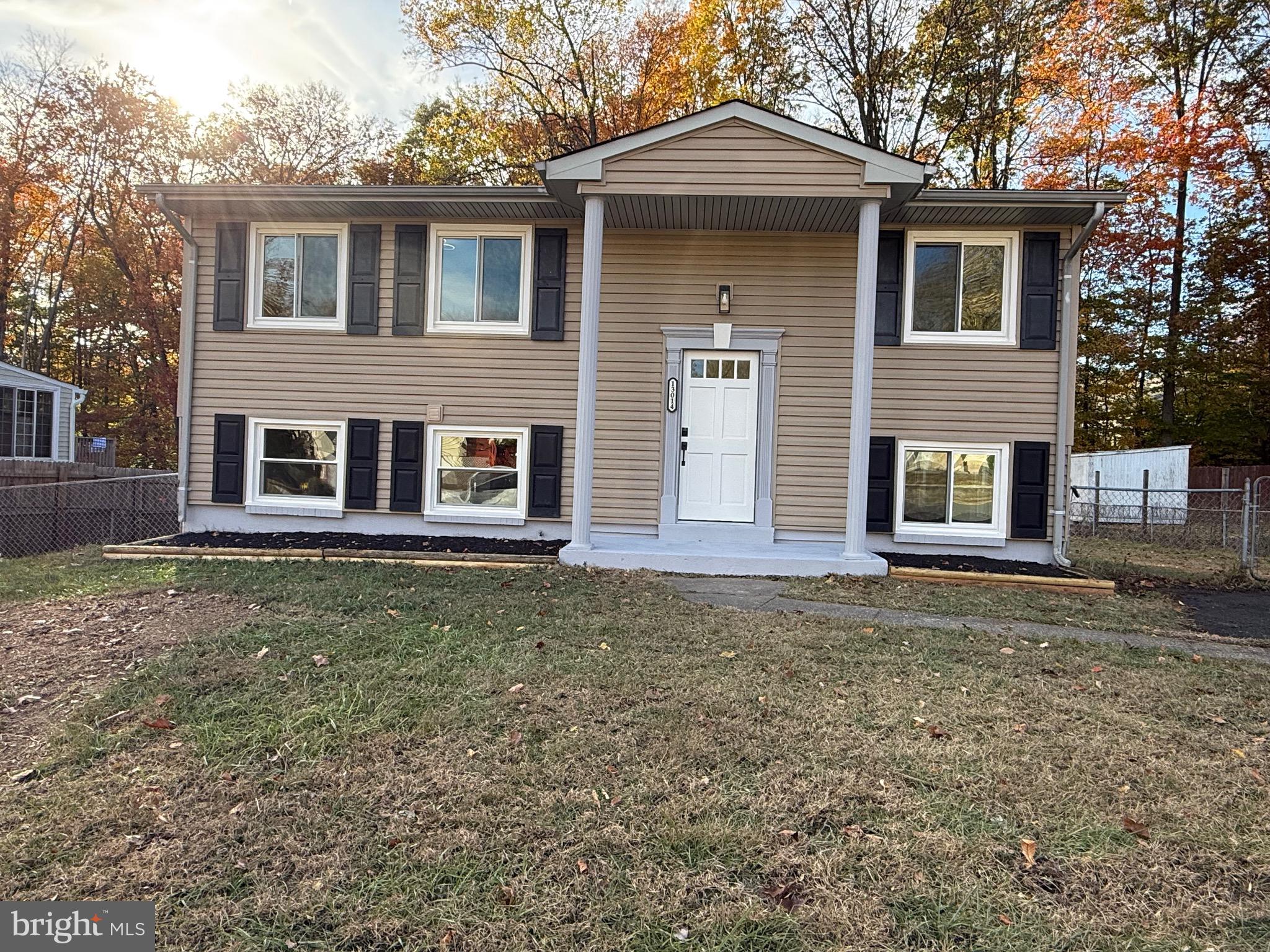 13014 Kerrydale Road Woodbridge, VA 22193 - Photo 7 of 53 a front view of a house with garden