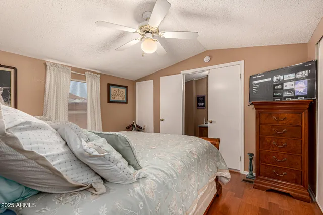 a bedroom with a bed and a dresser