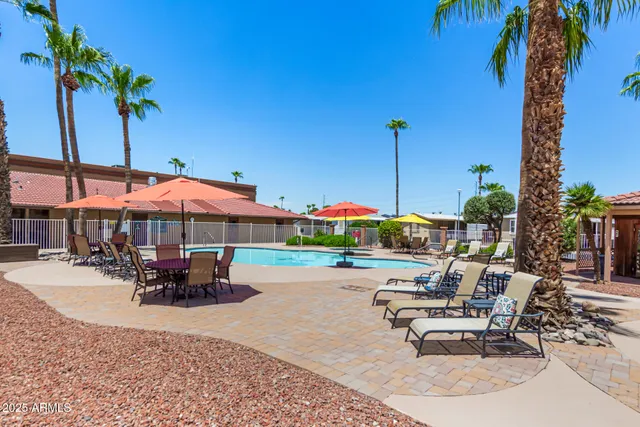 a view of chairs and tables in the patio