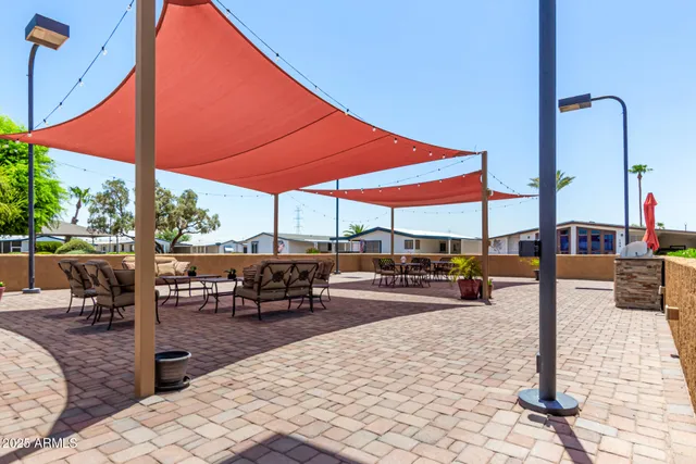 a view of a backyard with sitting area