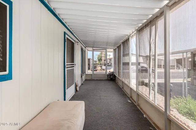 a view of a hallway with windows