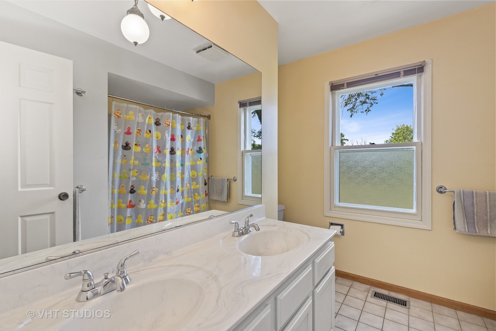 886 Fair Way Libertyville, IL 60048 - Photo 14 of 17 a bathroom with a granite countertop tub a sink and a mirror