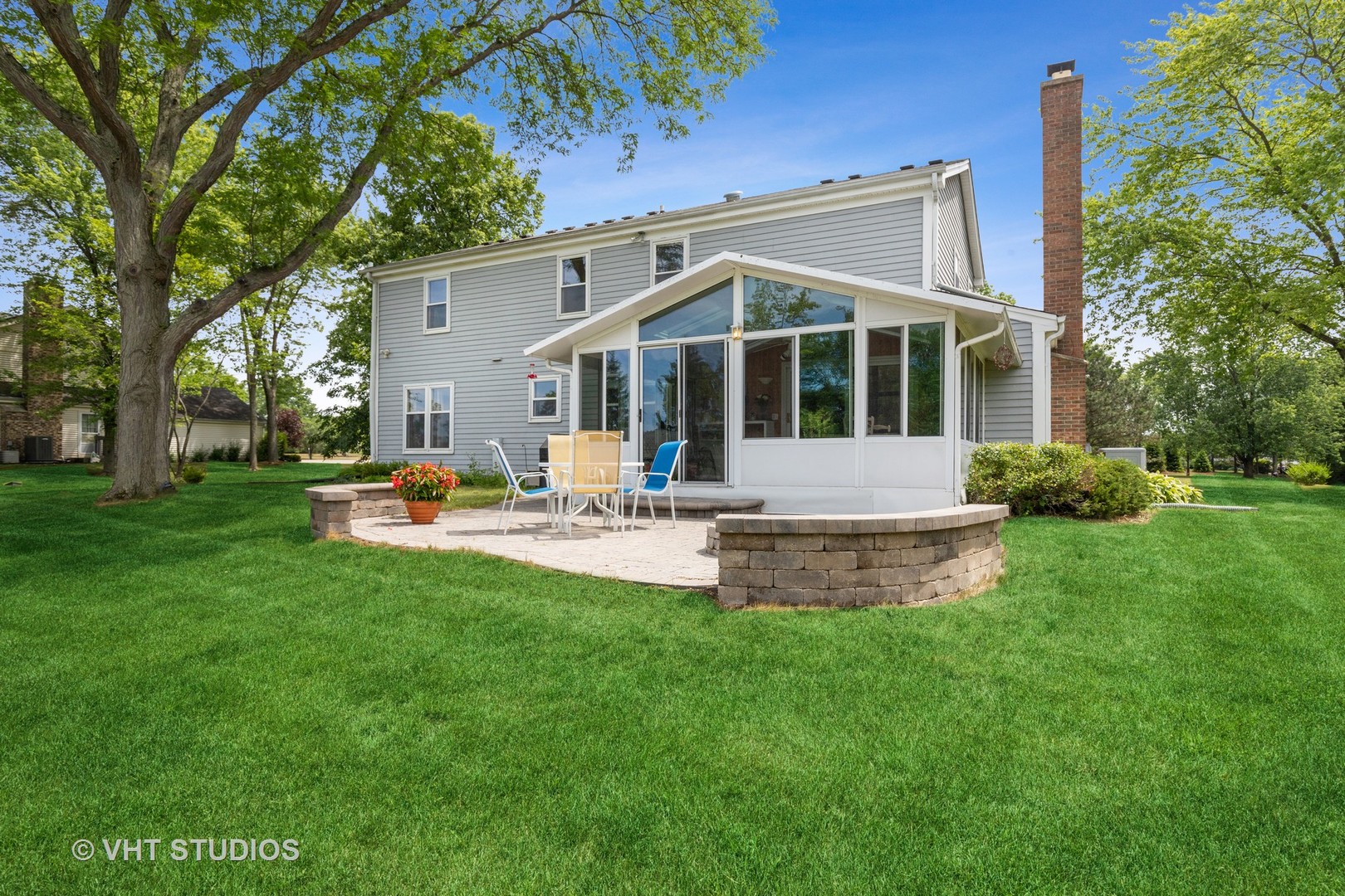 886 Fair Way Libertyville, IL 60048 - Photo 16 of 17 a front view of a house with a yard patio and green space
