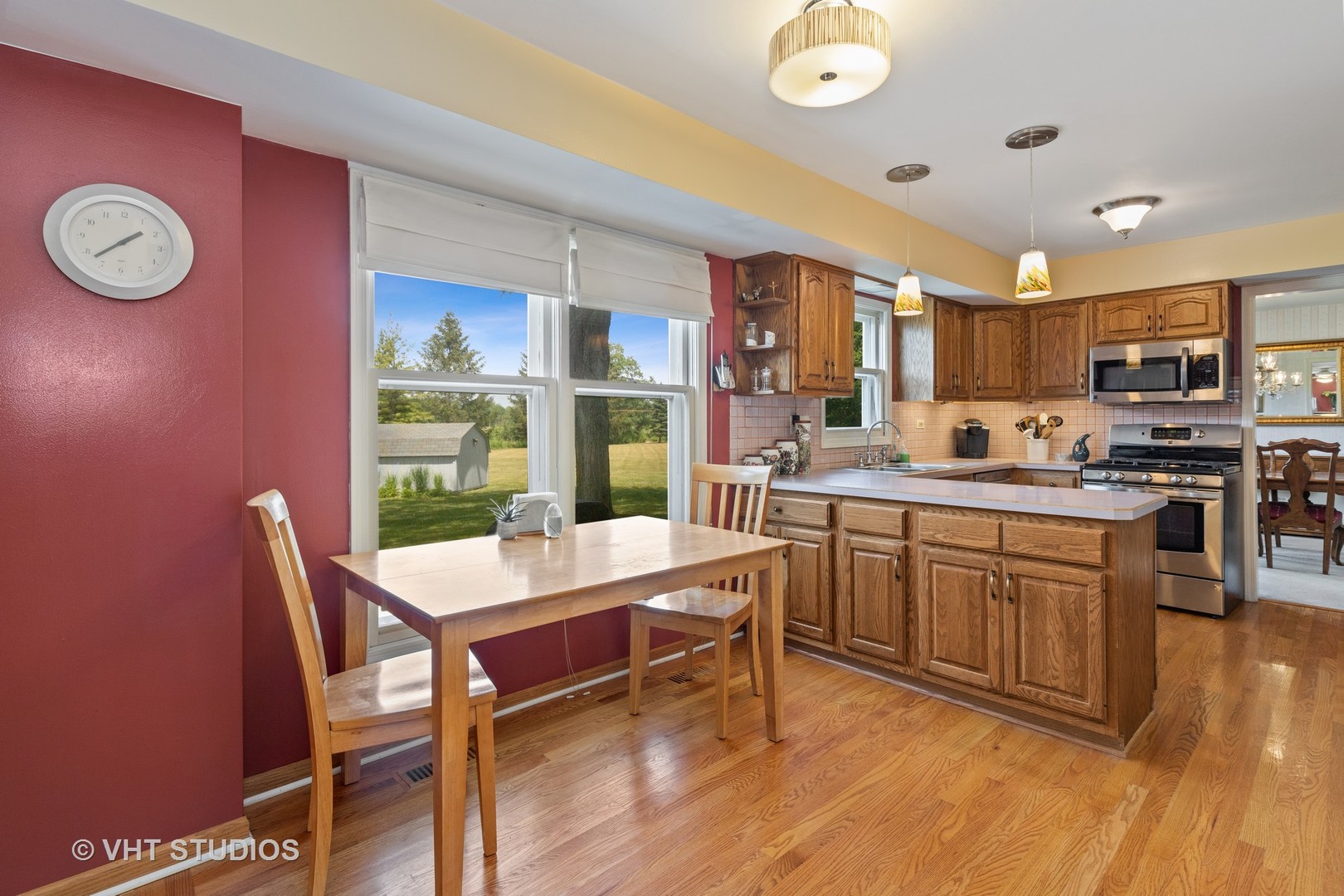 886 Fair Way Libertyville, IL 60048 - Photo 5 of 17 a kitchen with a table chairs and a refrigerator