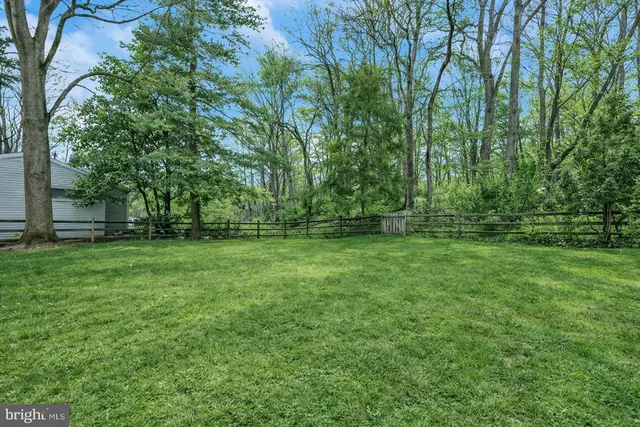 a view of outdoor space with deck and yard