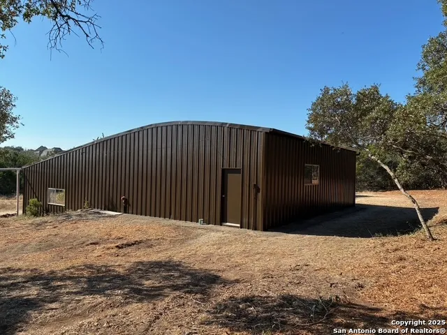 a view of a backyard of the house