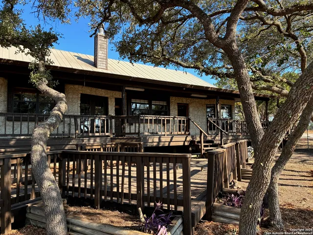 a view of a chairs and table in a patio