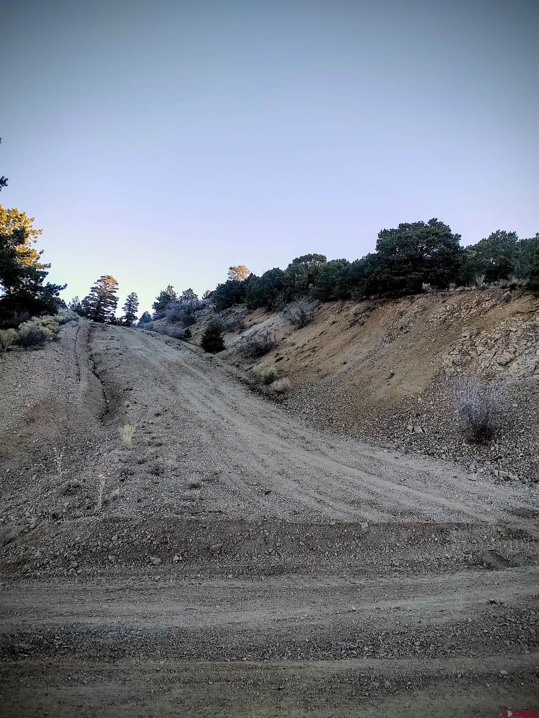 Lot 5701 Dettman Road Fort Garland, CO 81133 - Photo 5 of 7 a view of a dry yard with wooden fence