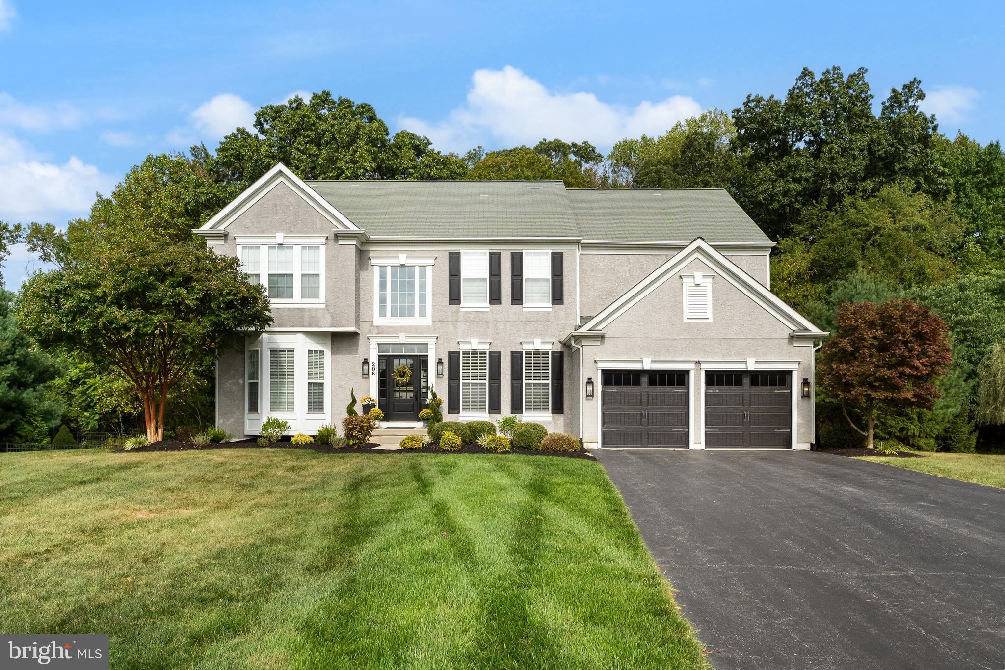 206 Sullivan Drive Mickleton, NJ 08056 - Photo 1 of 59 a front view of a house with a yard