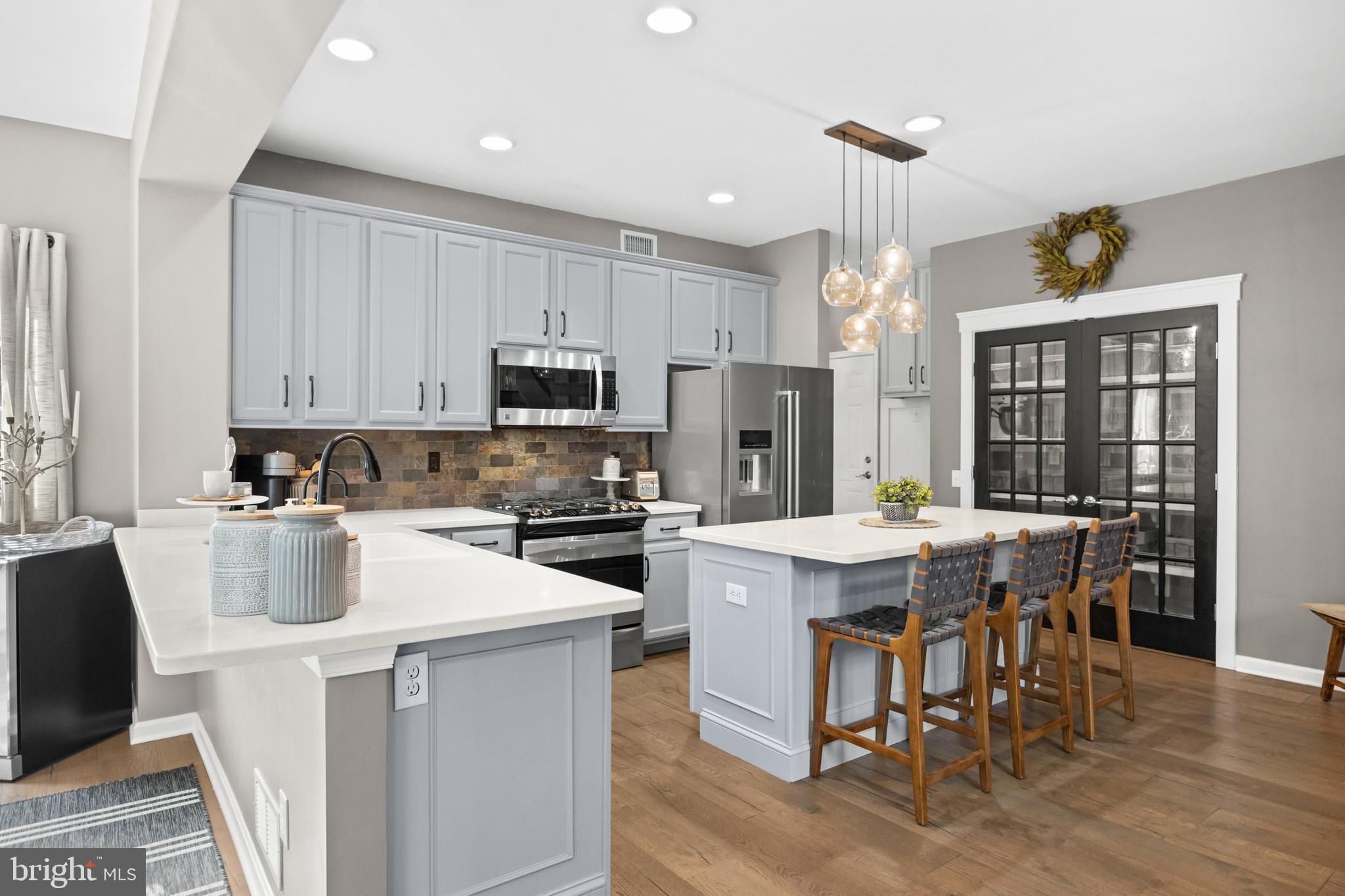 206 Sullivan Drive Mickleton, NJ 08056 - Photo 16 of 59 a kitchen that has a lot of cabinets a sink and appliances in it
