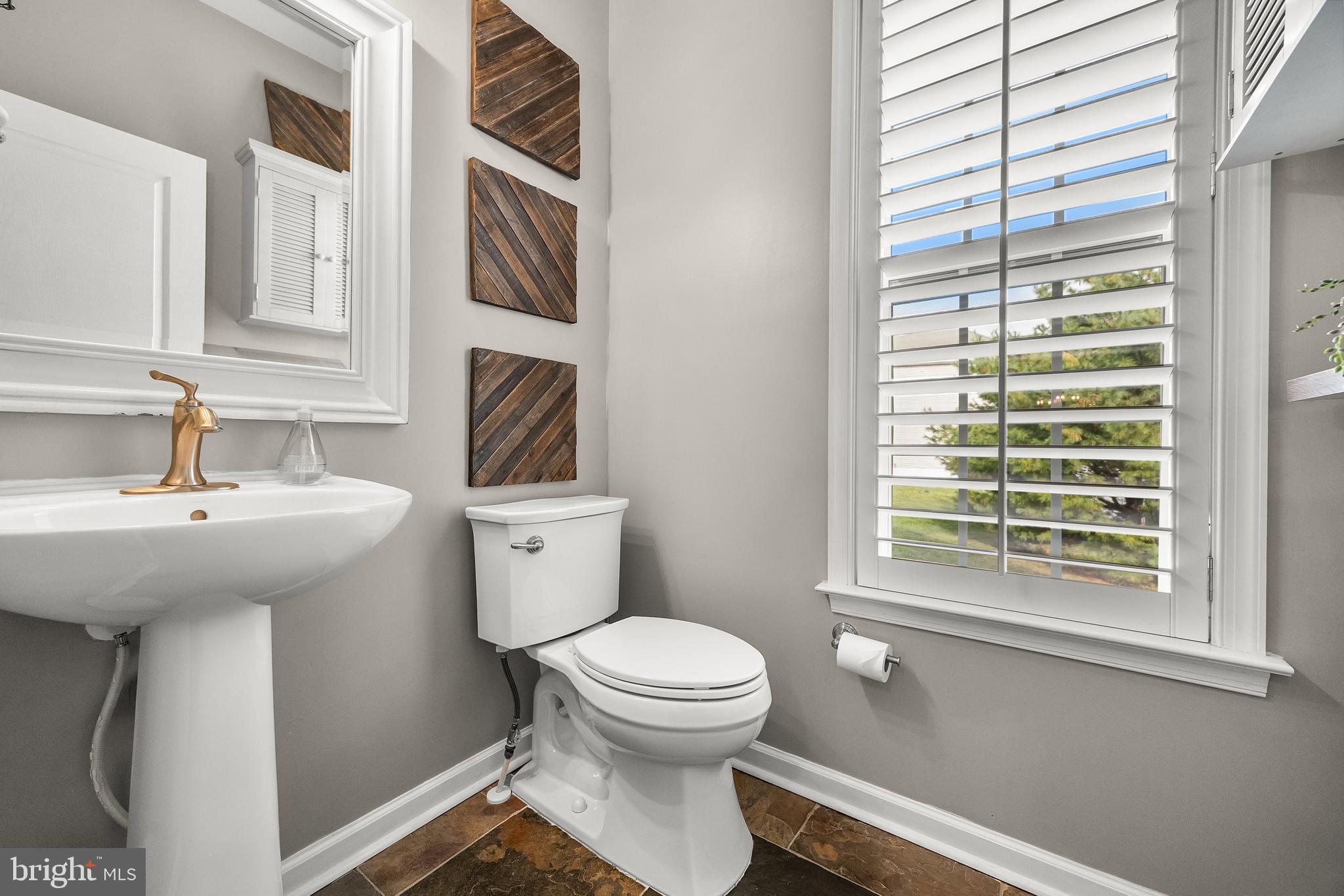 206 Sullivan Drive Mickleton, NJ 08056 - Photo 21 of 59 a bathroom with a sink a toilet and a window