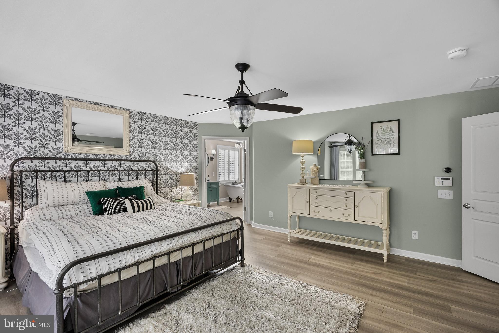 206 Sullivan Drive Mickleton, NJ 08056 - Photo 25 of 59 a bedroom with a bed and a chandelier