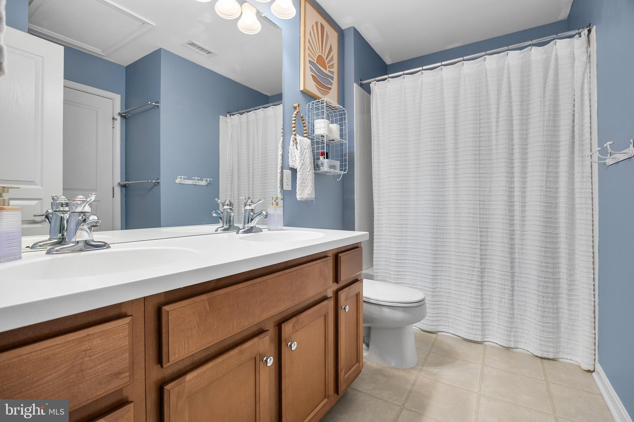 206 Sullivan Drive Mickleton, NJ 08056 - Photo 33 of 59 a bathroom with a double vanity sink toilet and a mirror