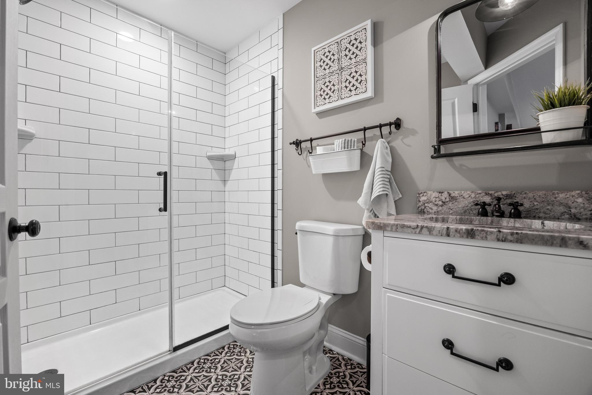206 Sullivan Drive Mickleton, NJ 08056 - Photo 38 of 59 a bathroom with a granite countertop toilet and sink