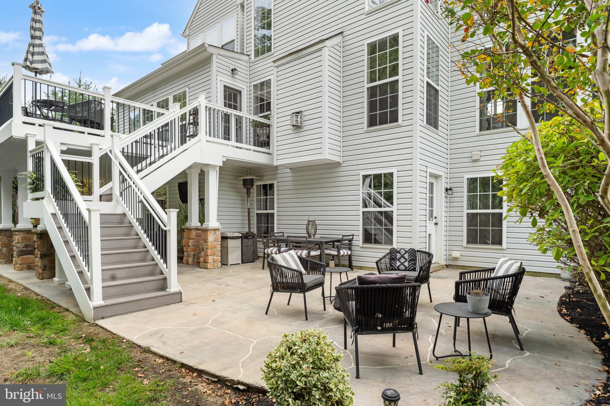 206 Sullivan Drive Mickleton, NJ 08056 - Photo 47 of 59 a view of a patio with table and chairs