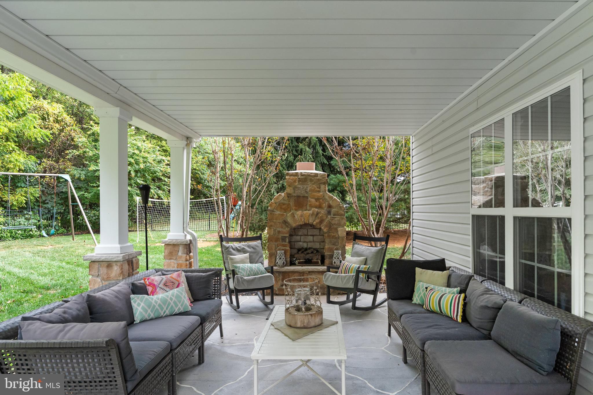 206 Sullivan Drive Mickleton, NJ 08056 - Photo 48 of 59 a outdoor space with patio the couches and a dining table with garden view