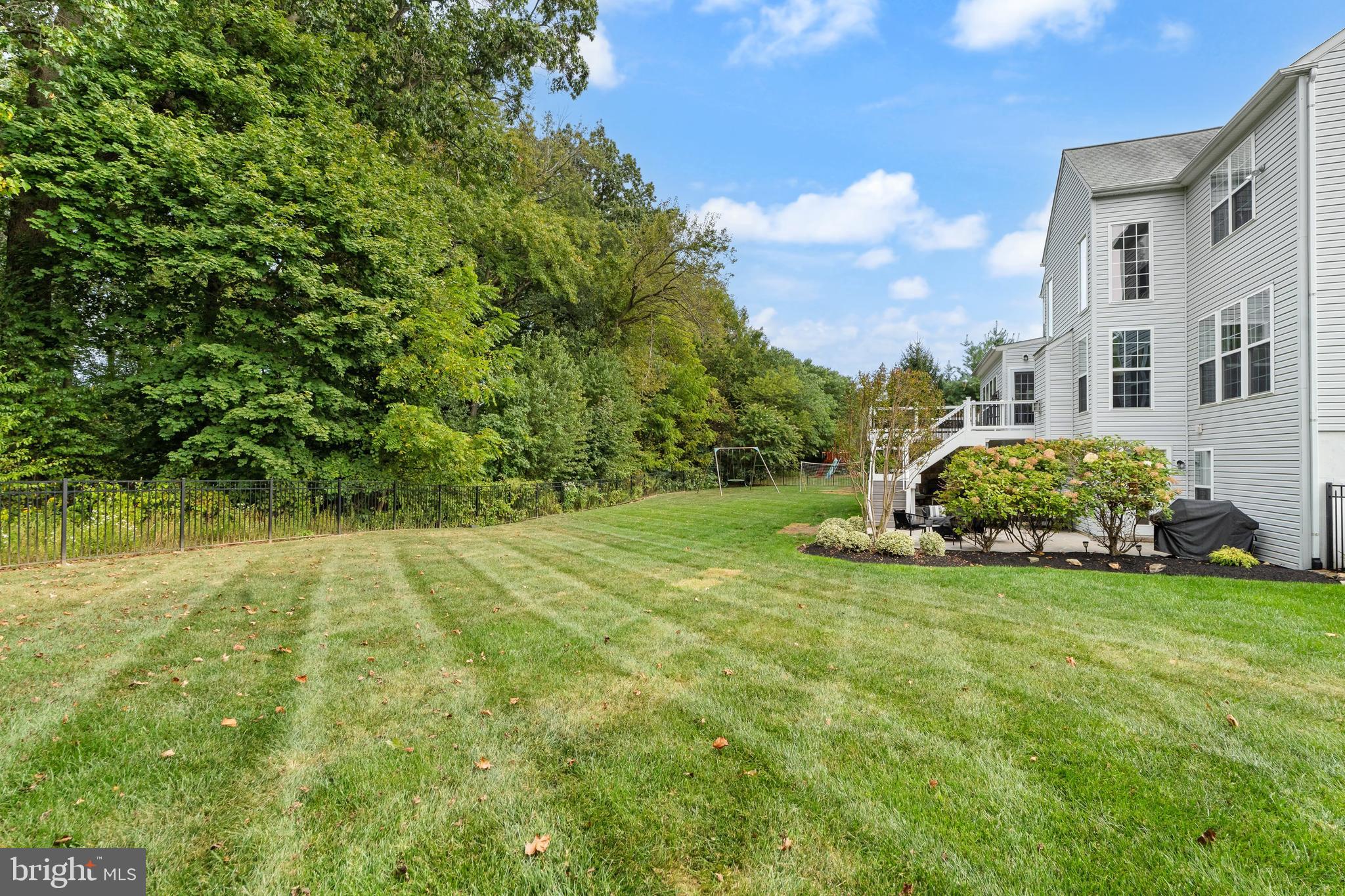 206 Sullivan Drive Mickleton, NJ 08056 - Photo 52 of 59 a view of a big yard with plants and large trees