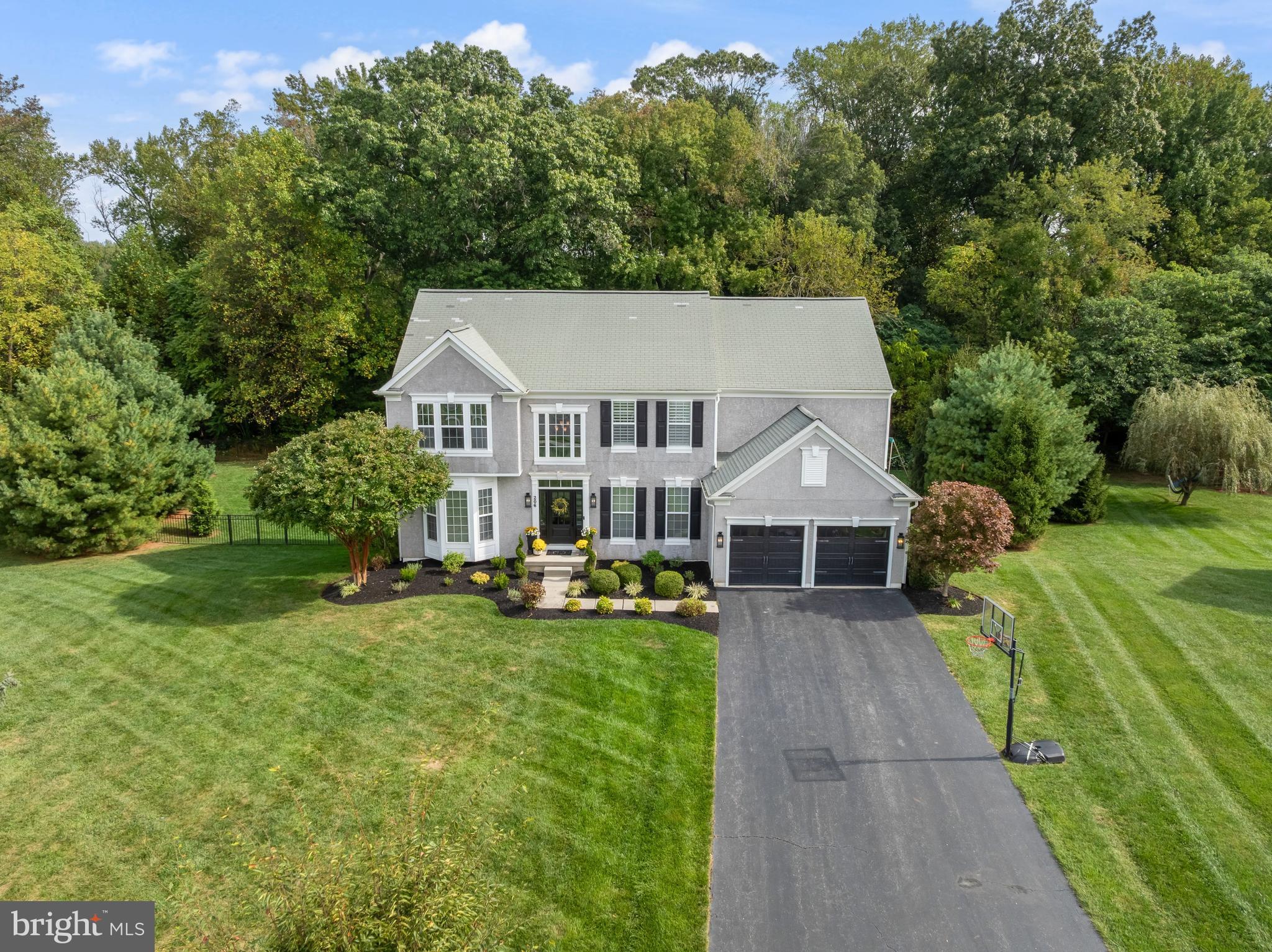 206 Sullivan Drive Mickleton, NJ 08056 - Photo 53 of 59 a front view of a house with a yard table and chairs