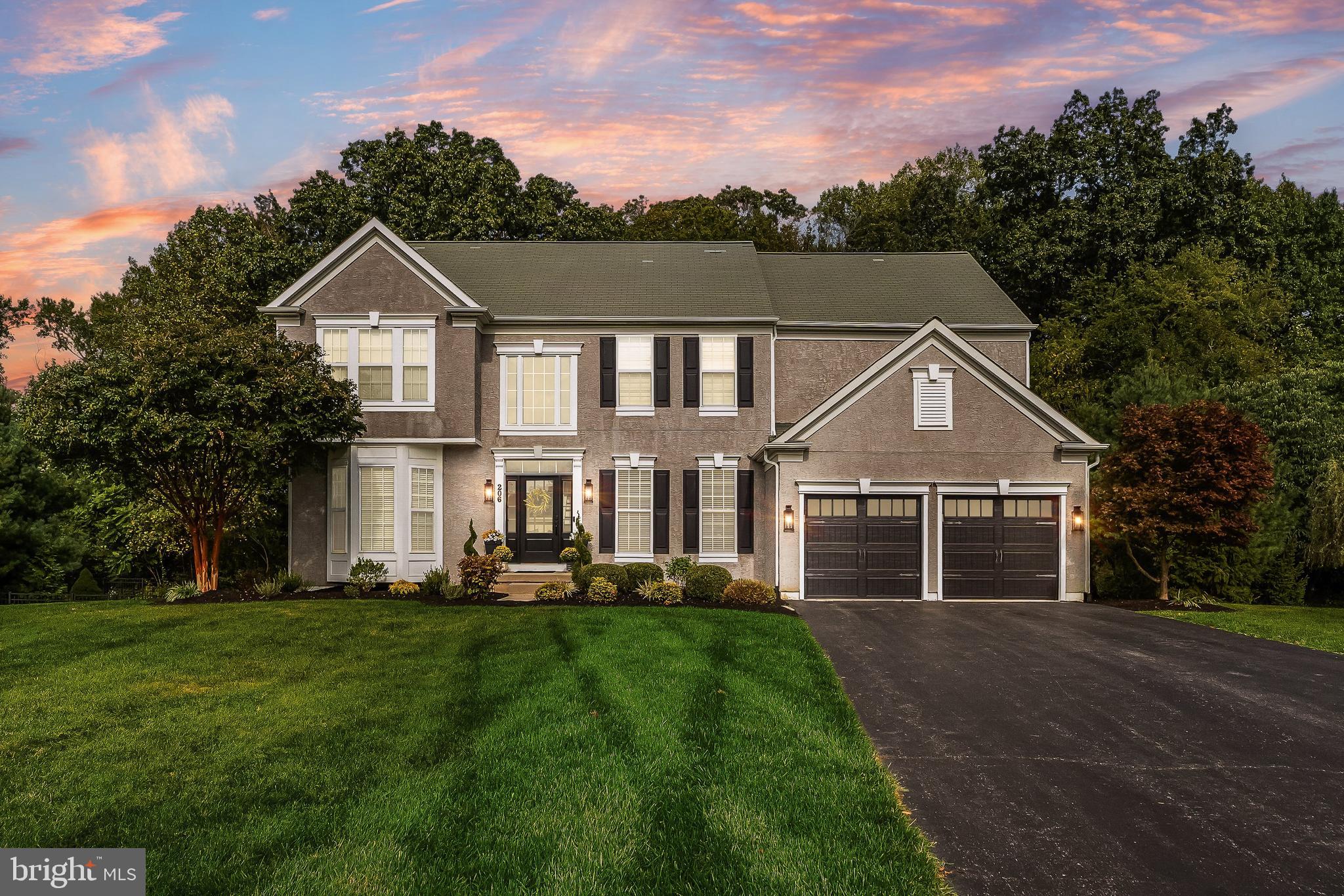 206 Sullivan Drive Mickleton, NJ 08056 - Photo 55 of 59 a front view of a house with a yard and trees
