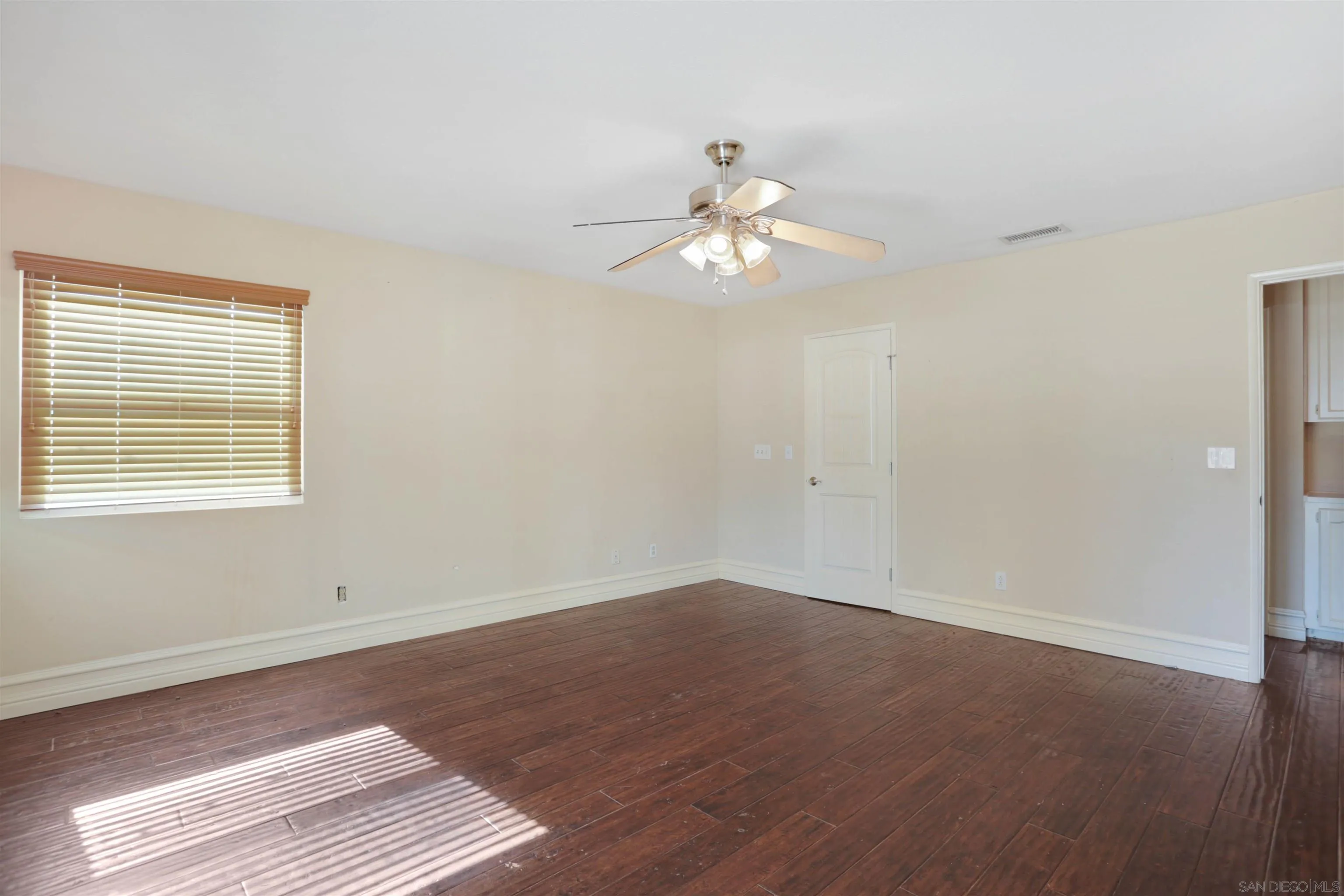 23641 Springwood Drive Ramona, CA 92065 - Photo 12 of 34 a view of empty room with wooden floor and fan