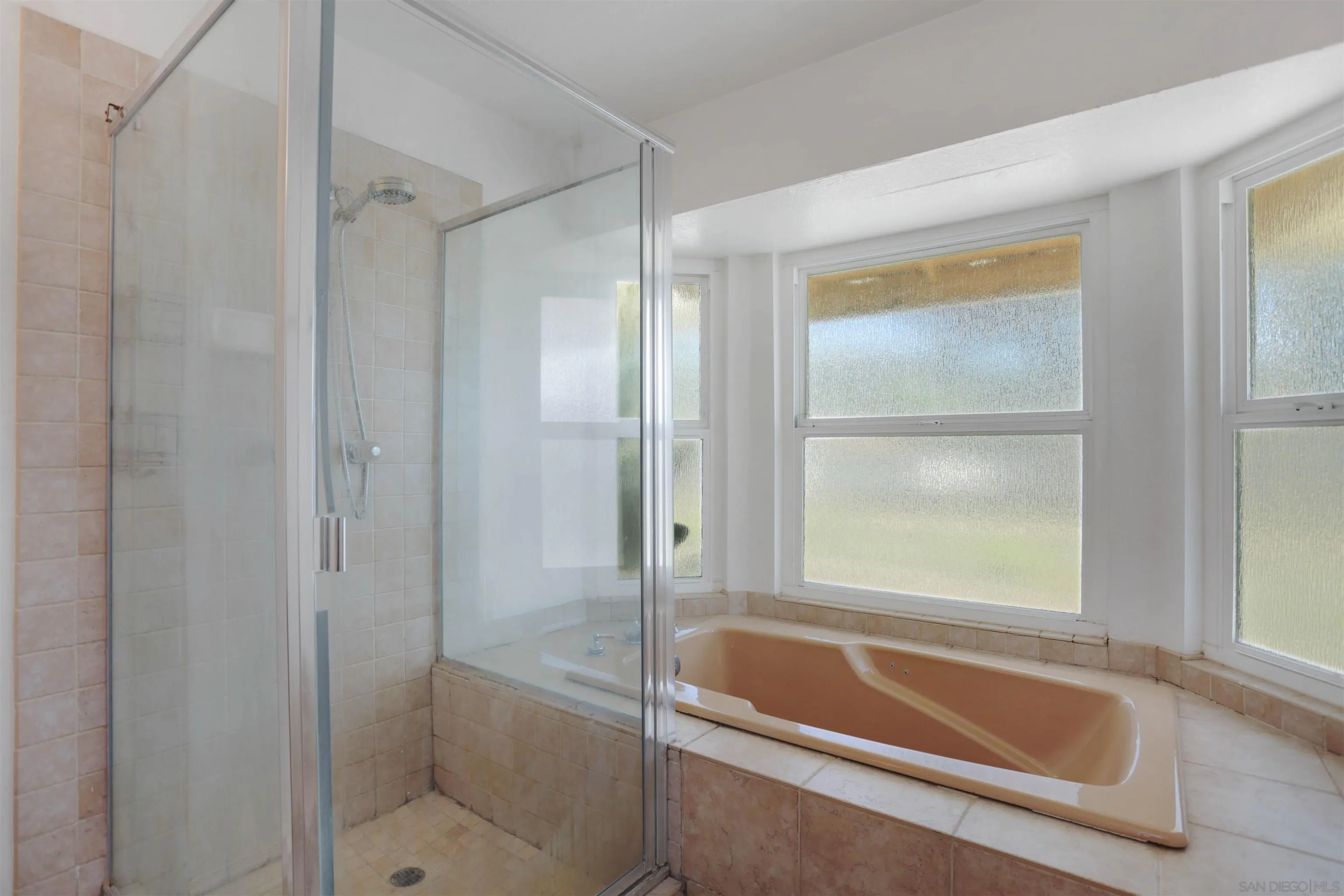 23641 Springwood Drive Ramona, CA 92065 - Photo 14 of 34 a bathroom with a tub shower and sink