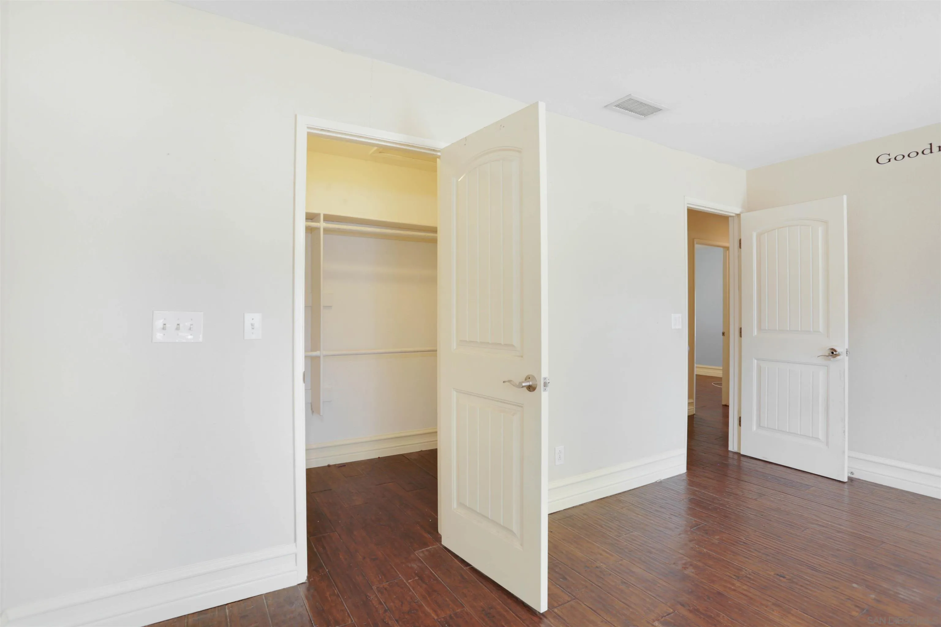 23641 Springwood Drive Ramona, CA 92065 - Photo 17 of 34 a view of an empty room with wooden floor and closet