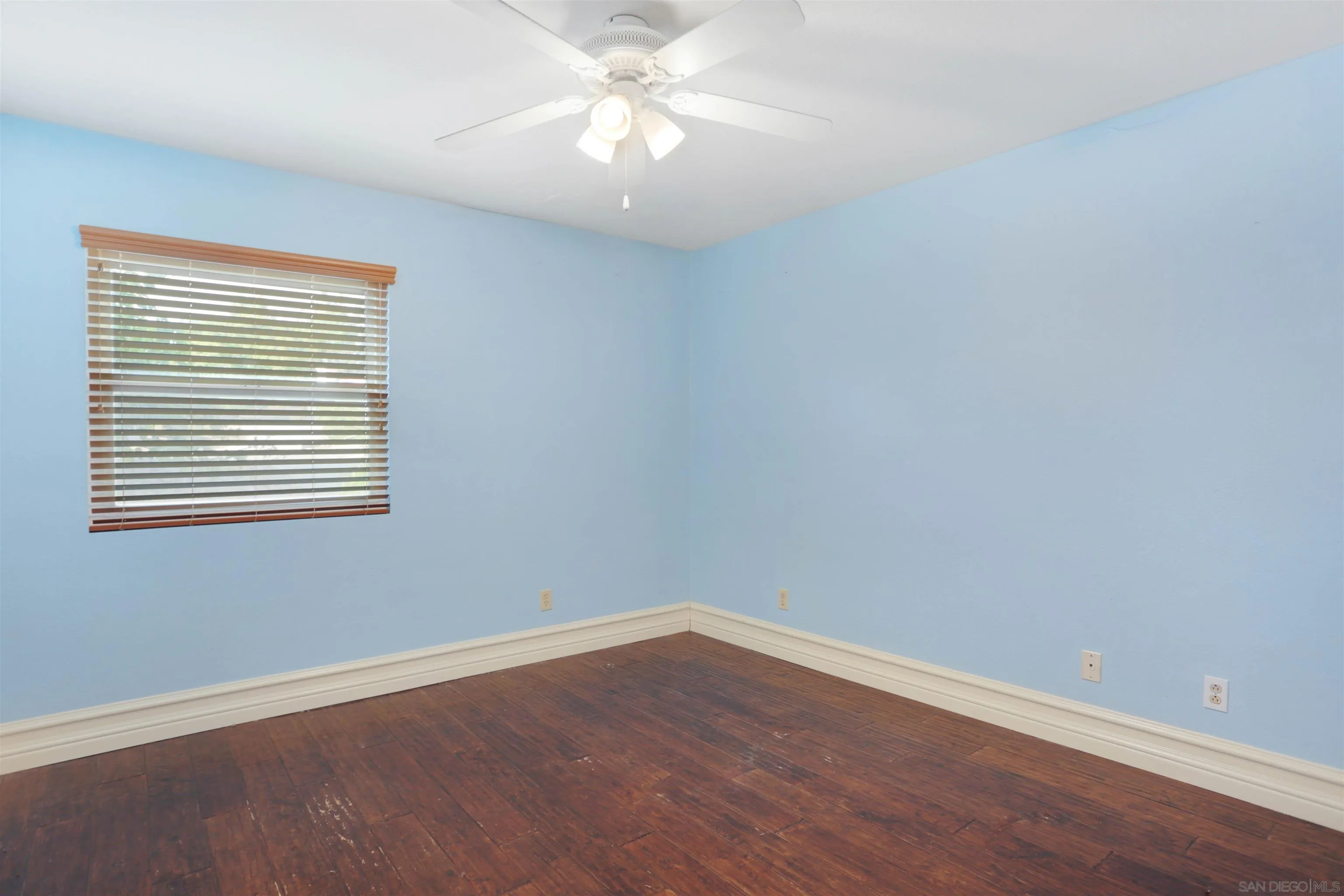 23641 Springwood Drive Ramona, CA 92065 - Photo 23 of 34 wooden floor in an empty room with a window