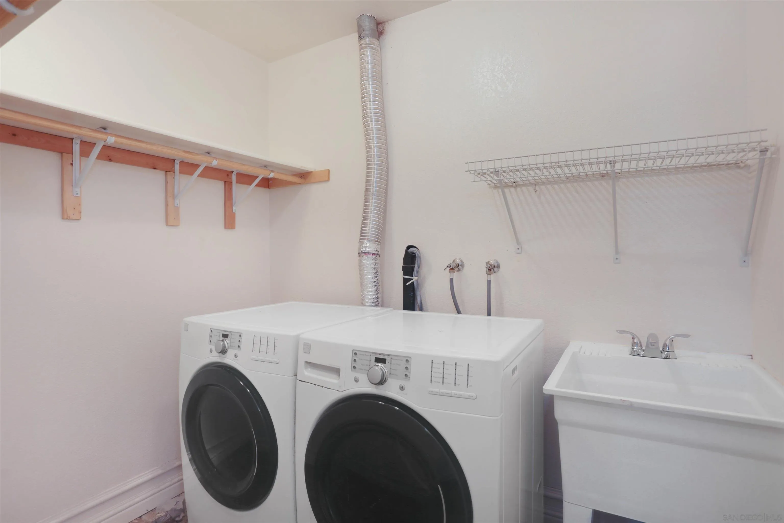 23641 Springwood Drive Ramona, CA 92065 - Photo 24 of 34 a utility room with dryer and washer