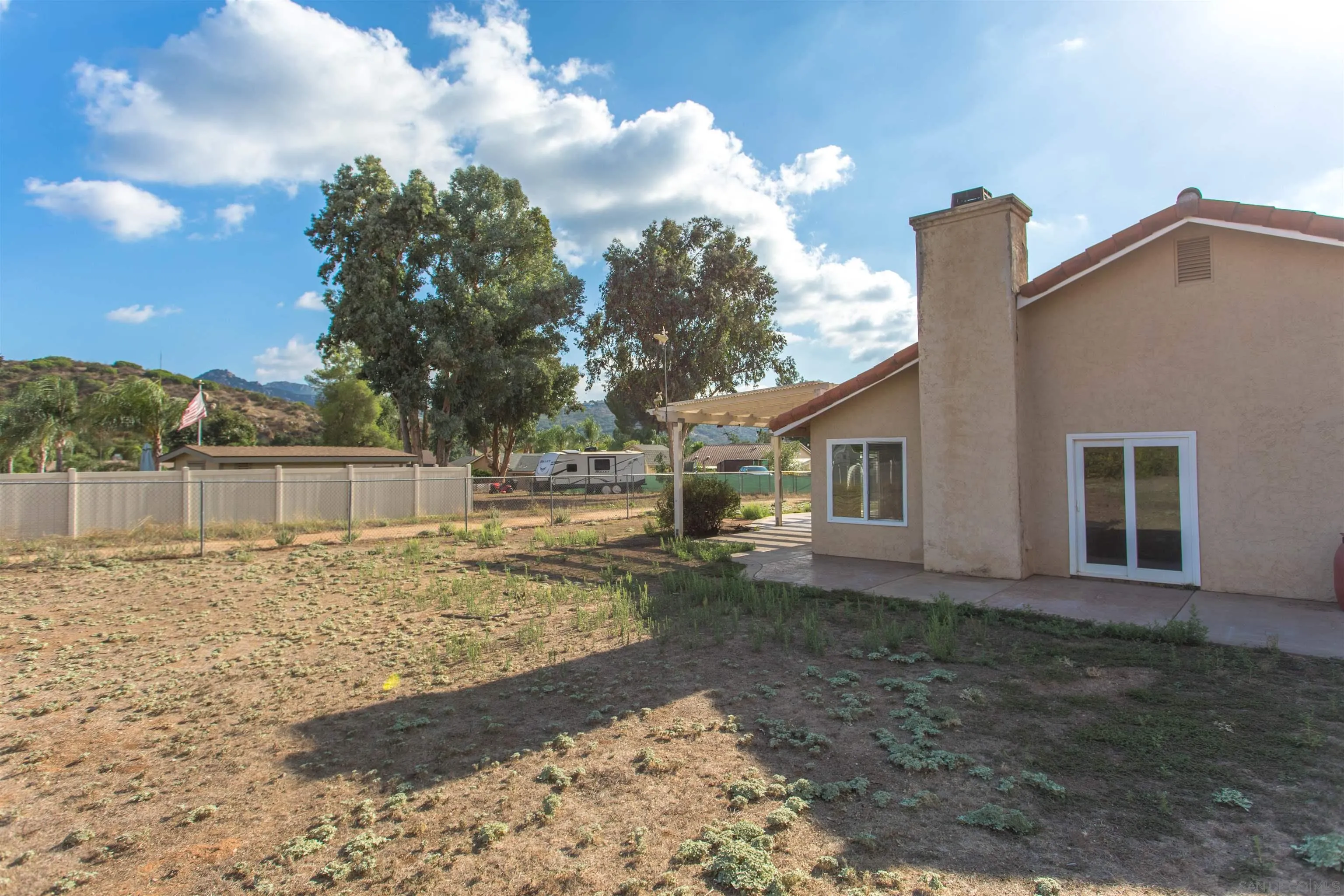 23641 Springwood Drive Ramona, CA 92065 - Photo 29 of 34 a view of a house with a yard